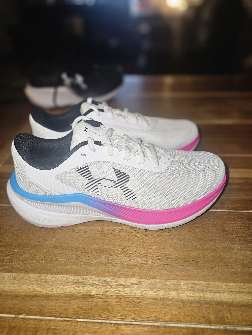 Under Armour Women’s White Running Sneakers with Blue & Pink Accents